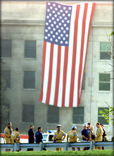 This American flag was unfurled at the Pentagon as Pres. Bush arrived. (abc)