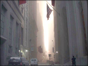 Smoke fills the canyons of NYC, but the flag flies on. (abc)